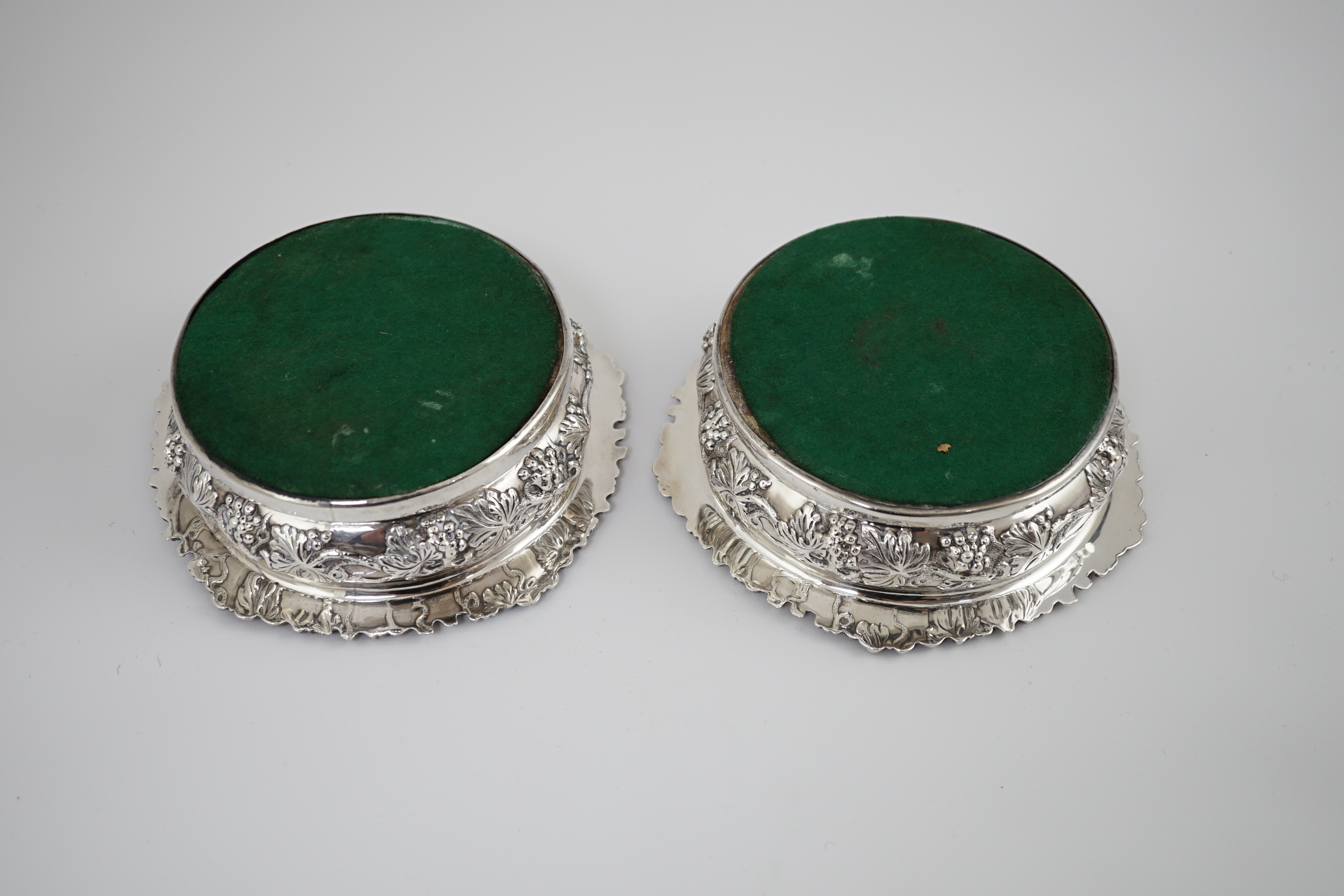 A pair of George IV silver wine coasters, by S.C. Younge & Co